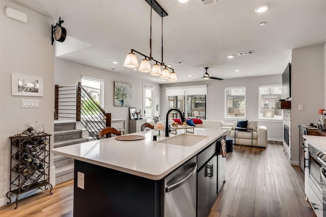 720 Bandera Ct, Prosper, TX 75078 - kitchen featuring a sink, dishwasher, a wealth of natural light, light countertops, and visible vents