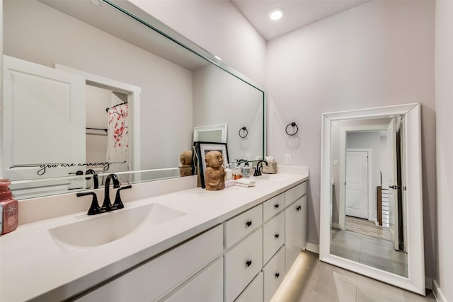 720 Bandera Ct, Prosper, TX 75078 - bathroom featuring tile patterned floors, a sink, recessed lighting, and double vanity