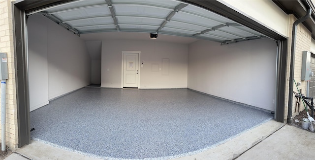 720 Bandera Ct, Prosper, TX 75078 - garage featuring baseboards and a garage door opener