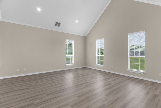 1991 Sunset Trl, Mckinney, TX 75071 - unfurnished room featuring baseboards, visible vents, wood finished floors, high vaulted ceiling, and ornamental molding