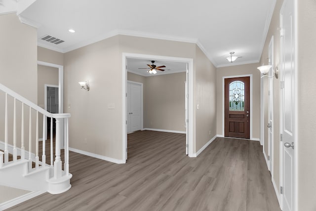 1991 Sunset Trl, Mckinney, TX 75071 - foyer entrance with stairway, ornamental molding, visible vents, and light wood-style flooring