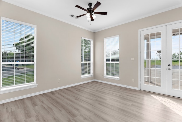 1991 Sunset Trl, Mckinney, TX 75071 - spare room with light wood finished floors, french doors, and crown molding
