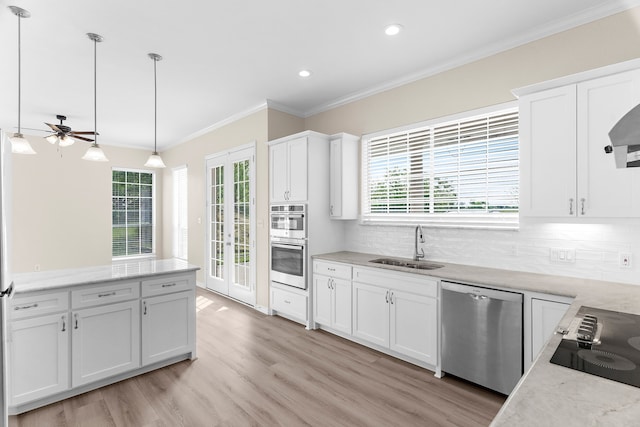 1991 Sunset Trl, Mckinney, TX 75071 - kitchen with a ceiling fan, a sink, appliances with stainless steel finishes, backsplash, and ornamental molding