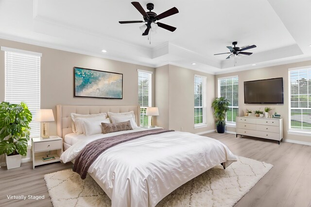 1991 Sunset Trl, Mckinney, TX 75071 - bedroom with baseboards, a tray ceiling, light wood-style floors, and ornamental molding