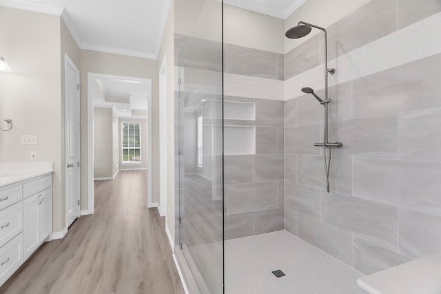 1991 Sunset Trl, Mckinney, TX 75071 - bathroom with wood finished floors, vanity, ornamental molding, and a tile shower