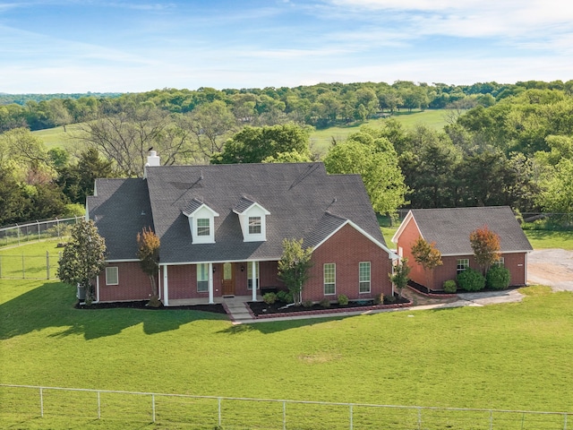 1991 Sunset Trl, Mckinney, TX 75071 - cape cod-style house featuring fence private yard, covered porch, a front yard, and brick siding