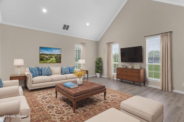 1991 Sunset Trl, Mckinney, TX 75071 - living room featuring light wood finished floors, visible vents, crown molding, baseboards, and high vaulted ceiling