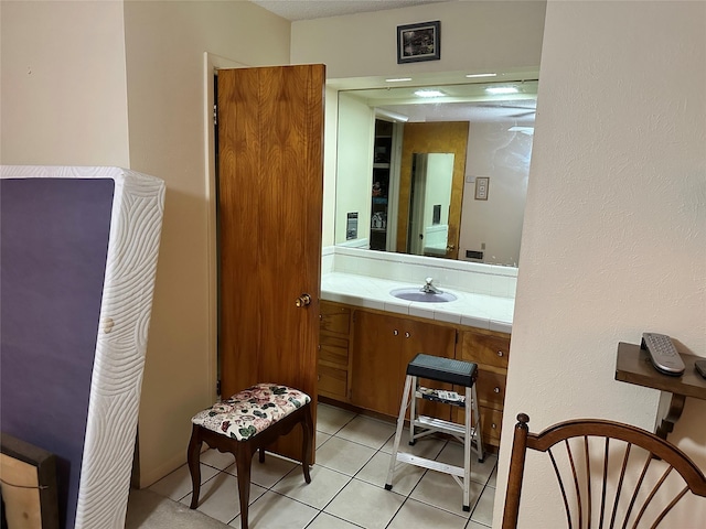 bathroom featuring tile patterned flooring and vanity