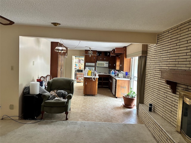living room featuring light colored carpet and a textured ceiling