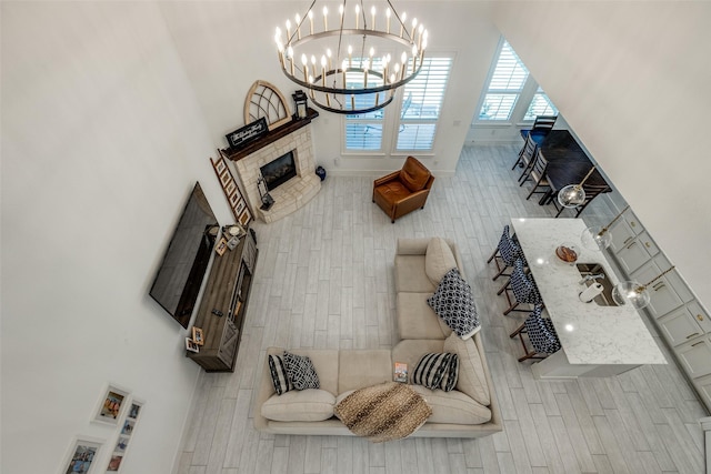 living room featuring baseboards and an inviting chandelier