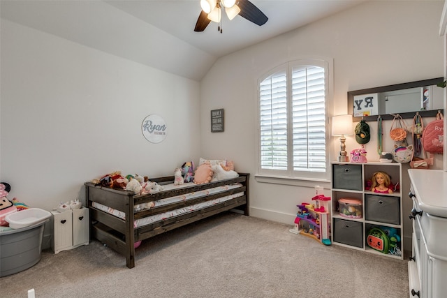 bedroom with vaulted ceiling, baseboards, carpet floors, and a ceiling fan