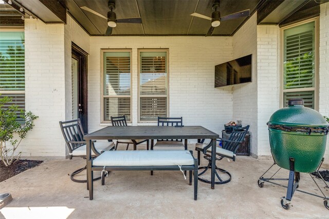 view of patio / terrace featuring outdoor dining area and a ceiling fan