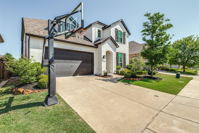 view of front facade with a garage, a front lawn, brick siding, and concrete driveway