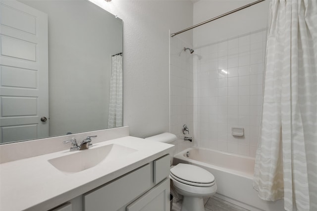 bathroom featuring toilet, vanity, and shower / bath combo with shower curtain