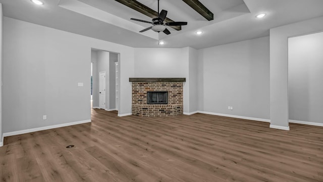 unfurnished living room featuring baseboards, a ceiling fan, wood finished floors, and recessed lighting