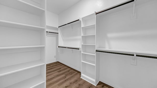 spacious closet with wood finished floors