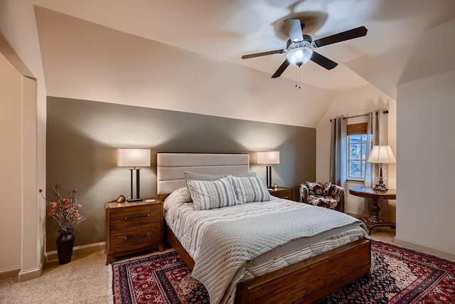 bedroom featuring lofted ceiling, ceiling fan, baseboards, and carpet flooring