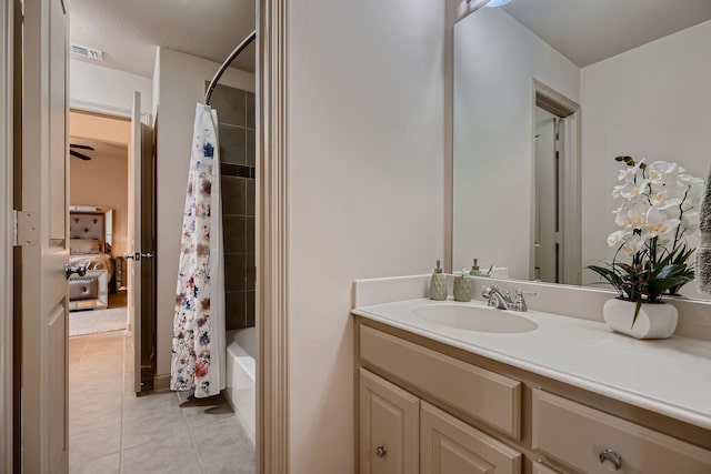 bathroom featuring visible vents, tile patterned floors, vanity, and shower / tub combo