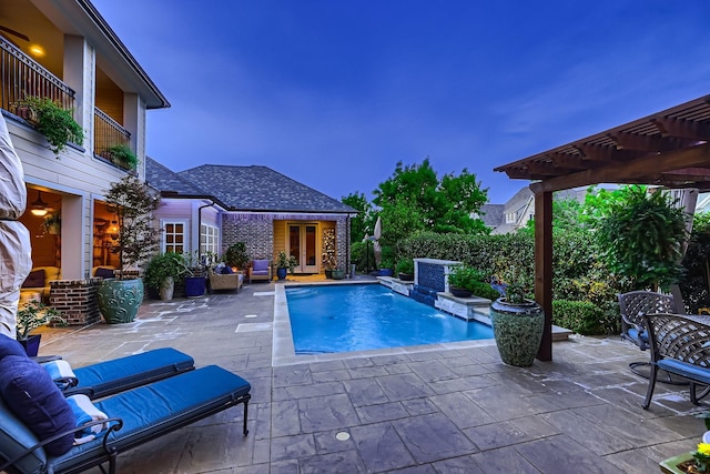 view of swimming pool with a pergola, a patio, a fenced in pool, and french doors
