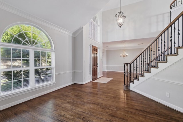 2704 Wisdom Creek Dr, Flower Mound, TX 75022 - foyer with a chandelier, stairway, wood finished floors, baseboards, and high vaulted ceiling