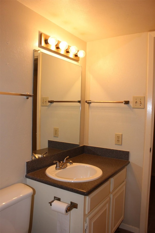4544 Chaha Rd Unit 103, Garland, TX 75043 - half bathroom with vanity and toilet