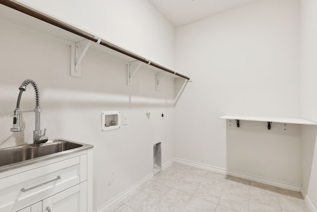 washroom featuring hookup for a washing machine, a sink, electric dryer hookup, cabinet space, and hookup for a gas dryer