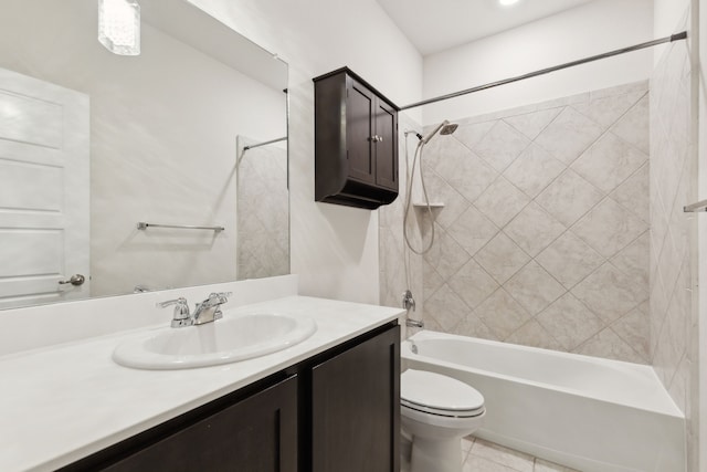 bathroom featuring tile patterned floors, toilet, vanity, and shower / washtub combination