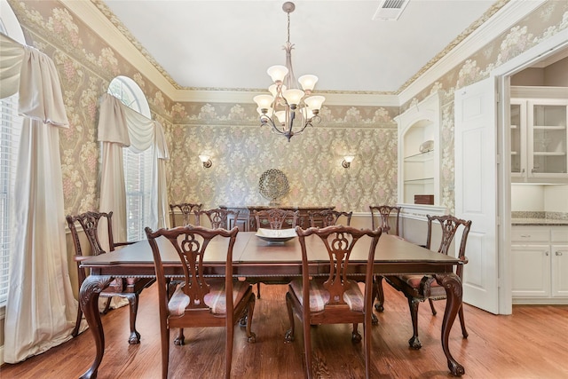 803 Eagle Pass, Heath, TX 75032 - dining room featuring wallpapered walls, a chandelier, light wood finished floors, and ornamental molding