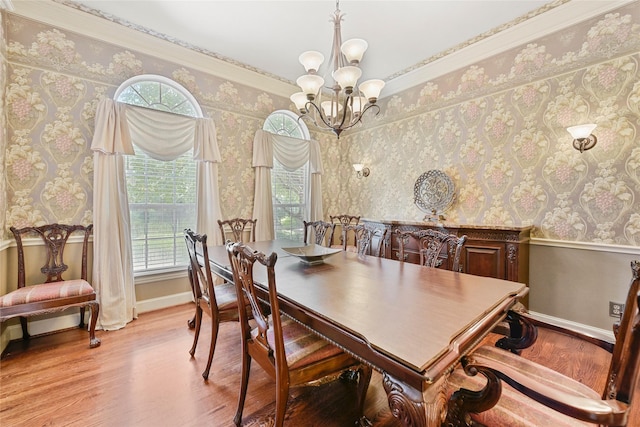 803 Eagle Pass, Heath, TX 75032 - dining room featuring a chandelier, wallpapered walls, wood finished floors, baseboards, and ornamental molding