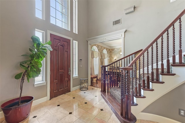 803 Eagle Pass, Heath, TX 75032 - foyer featuring a high ceiling, baseboards, stairs, and tile patterned flooring