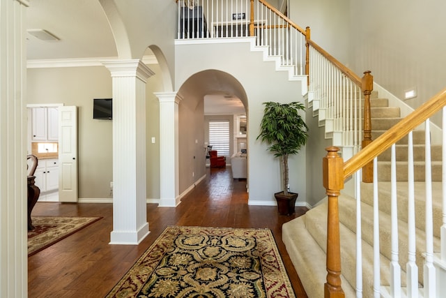 1609 Willow Ln, Mckinney, TX 75072 - entryway with dark wood finished floors, arched walkways, stairway, baseboards, and visible vents
