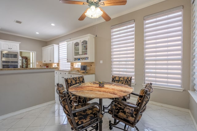 1609 Willow Ln, Mckinney, TX 75072 - dining room with ornamental molding, visible vents, ceiling fan, and a healthy amount of sunlight