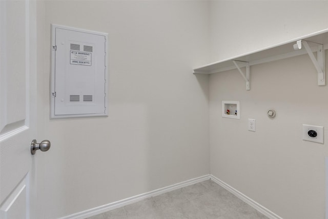 washroom with baseboards, hookup for a washing machine, hookup for a gas dryer, electric dryer hookup, and laundry area
