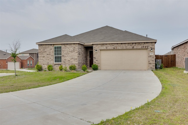 single story home with fence, concrete driveway, brick siding, a front yard, and a garage