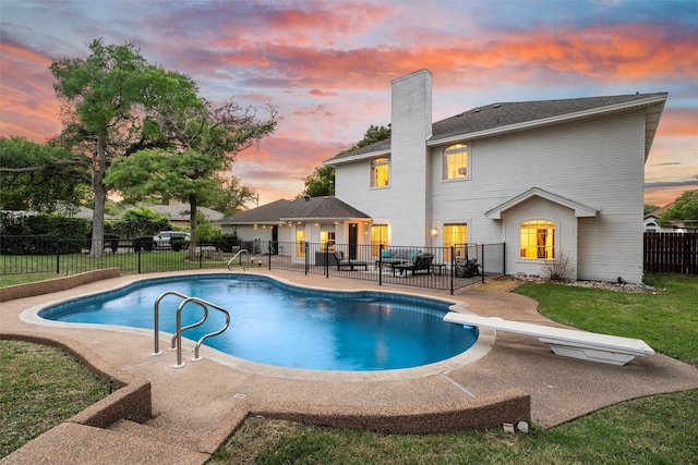 view of pool with a lawn, a patio area, a fenced backyard, and a fenced in pool