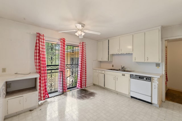 kitchen with light floors, white dishwasher, a sink, and light countertops