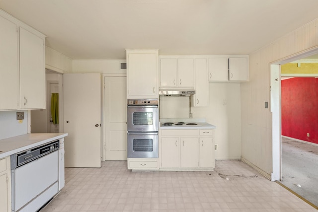 kitchen with under cabinet range hood, white appliances, light floors, light countertops, and white cabinetry