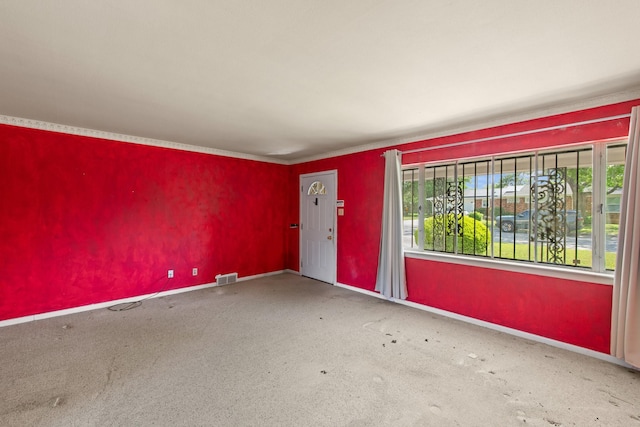 spare room featuring visible vents and baseboards