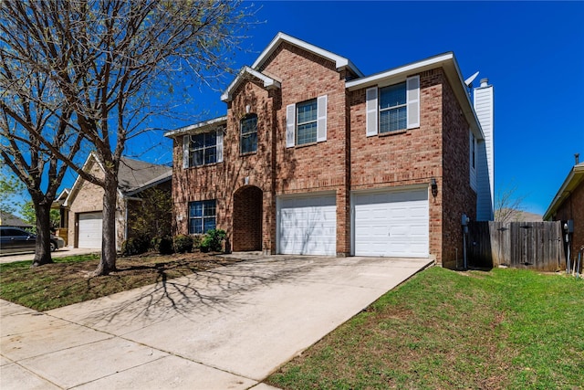 traditional-style home featuring fence, a front lawn, driveway, brick siding, and a garage