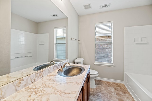 bathroom featuring visible vents, toilet, and vanity