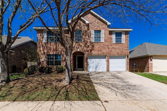 traditional home with concrete driveway, an attached garage, and brick siding