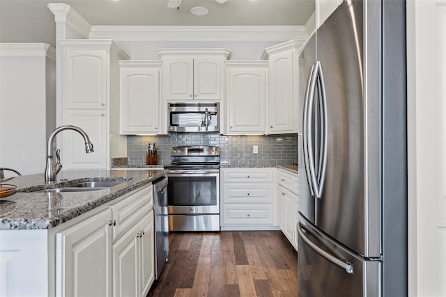 kitchen featuring white cabinets, a sink, dark wood-type flooring, stone counters, and appliances with stainless steel finishes