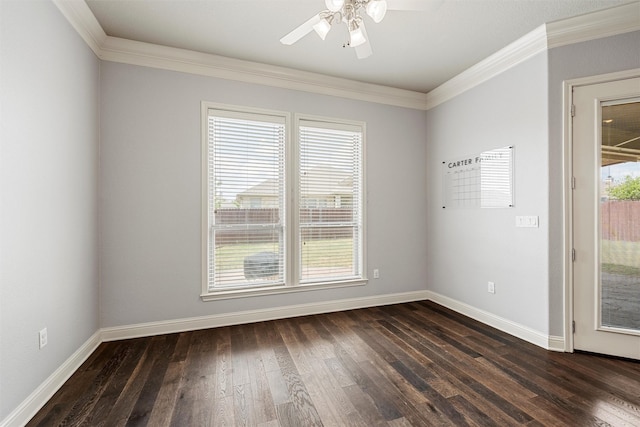 spare room featuring a healthy amount of sunlight, a ceiling fan, and dark wood-style flooring