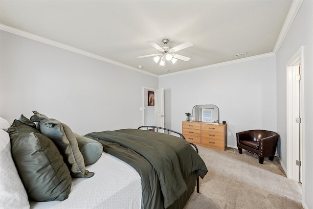 bedroom with light carpet, visible vents, baseboards, ceiling fan, and crown molding