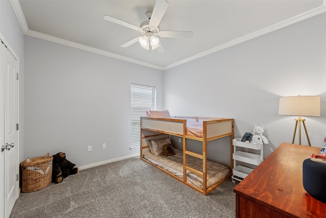 bedroom featuring carpet, a ceiling fan, baseboards, and ornamental molding