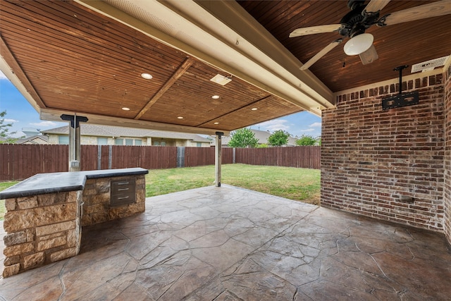 view of patio / terrace with a fenced backyard and ceiling fan