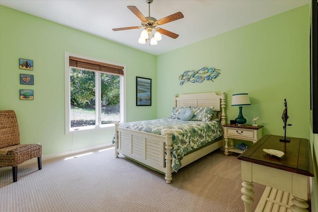bedroom with baseboards, a ceiling fan, and carpet flooring