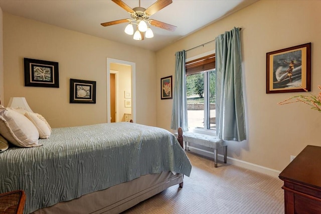 carpeted bedroom featuring baseboards and ceiling fan