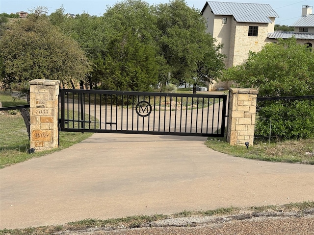 view of gate with fence
