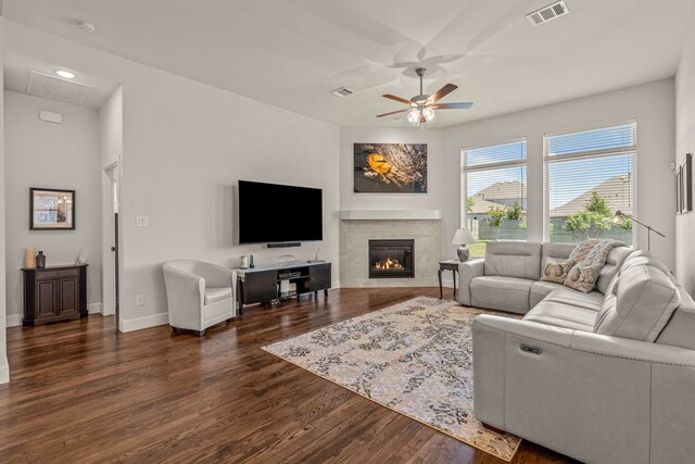 living room featuring ceiling fan, wood finished floors, and visible vents